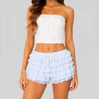 Front view of blue green layered ruffle mini shorts with elastic waist by BELLA HUDSON