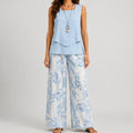 Front view of blue layered sleeveless top and wide leg pants set with floral print by BELLA HUDSON