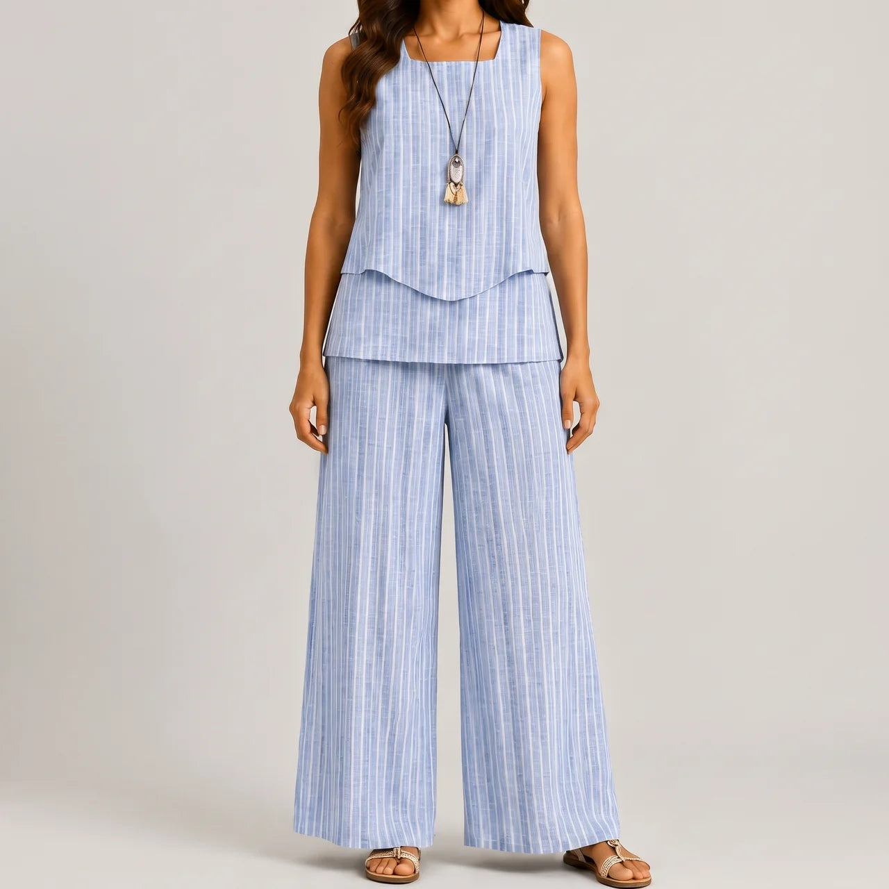 Front view of blue stripes layered sleeveless top and wide leg pants set by BELLA HUDSON
