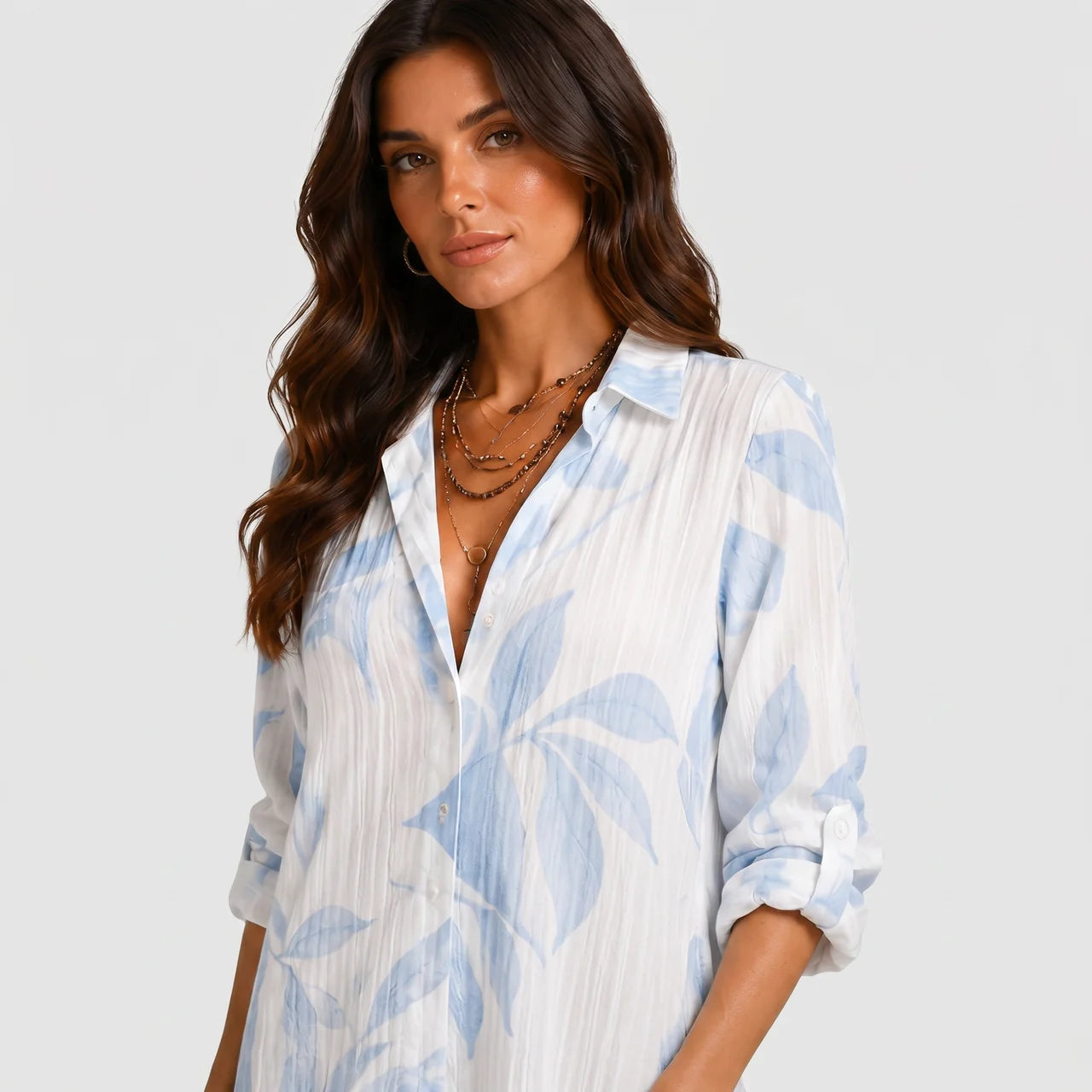 Close-up detail view of blue and white tropical print maxi dress with collar and button front by BELLA HUDSON