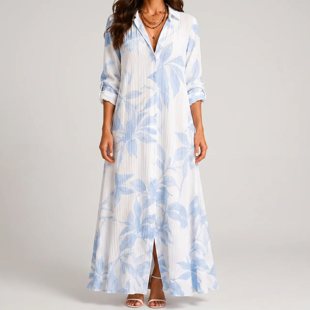 Front view of blue and white tropical print maxi dress with collar by BELLA HUDSON
