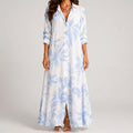 Front view of blue and white tropical print maxi dress with collar by BELLA HUDSON