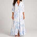 Front view of blue and white tropical print maxi dress with collar by BELLA HUDSON