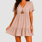 Front view of blush pink tiered mini dress with relaxed silhouette by BELLA HUDSON