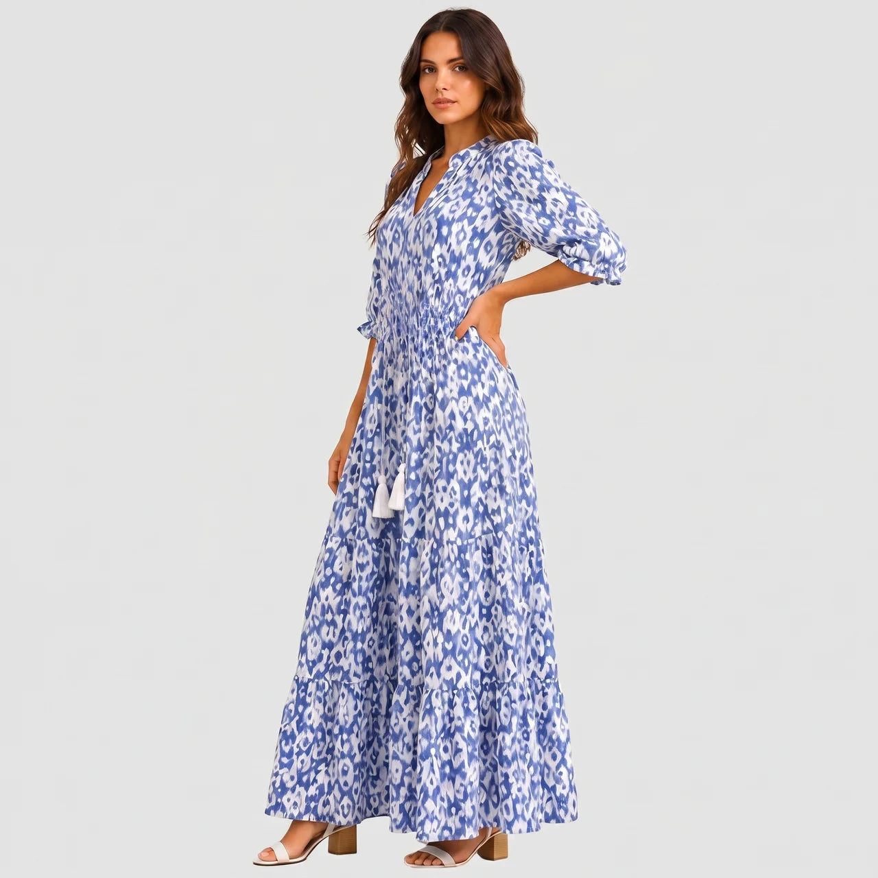Blue boho lightweight maxi dress side view with tiered silhouette and tassel tie detail BELLA HUDSON