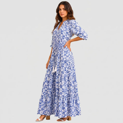 Blue boho lightweight maxi dress side view with tiered silhouette and tassel tie detail BELLA HUDSON