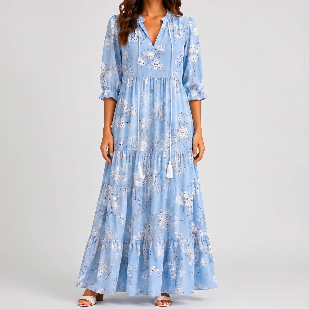 Light blue boho lightweight maxi dress front view with floral print and tassel tie detail BELLA HUDSON