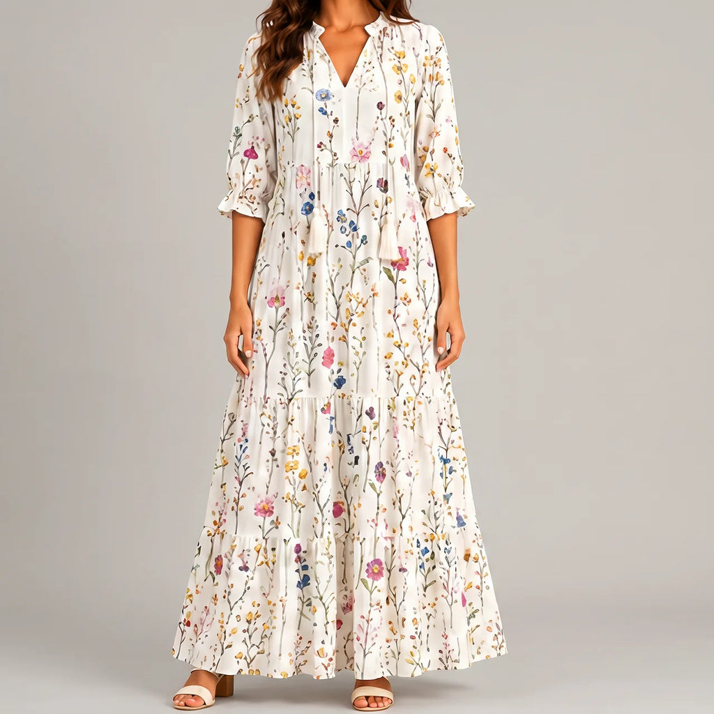 White boho lightweight maxi dress front view with delicate multicolor floral print and flowing tiered silhouette BELLA HUDSON