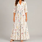 White boho lightweight maxi dress front view with delicate multicolor floral print and flowing tiered silhouette BELLA HUDSON