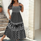 Front view of the Briar Smocked Dress Bohemian Puff-Sleeve Tiered in black, featuring a smocked bodice, square neckline, puff sleeves, and a tiered bohemian maxi skirt. Designed by Bella Hudson.