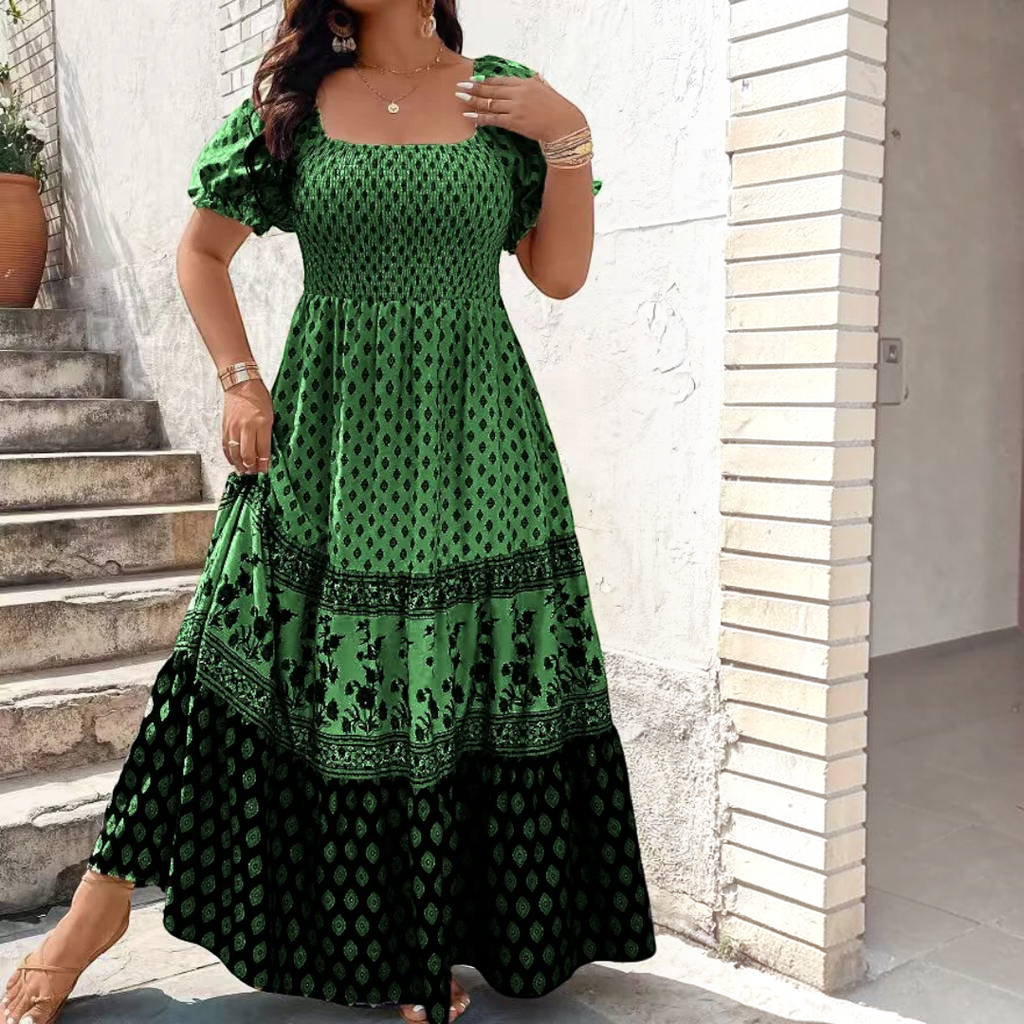 Front view of the Briar Smocked Dress Bohemian Puff-Sleeve Tiered in green, featuring a smocked bodice, puff sleeves, square neckline, and a bohemian-inspired tiered skirt. Designed by Bella Hudson.
