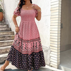 Front view of the Briar Smocked Dress Bohemian Puff-Sleeve Tiered in pink, featuring a smocked bodice, square neckline, puff sleeves, and a flowing tiered maxi silhouette. Designed by Bella Hudson.
