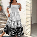 Front view of the Briar Smocked Dress Bohemian Puff-Sleeve Tiered in white, featuring a smocked bodice, square neckline, puff sleeves, and a tiered bohemian maxi skirt. Designed by Bella Hudson.