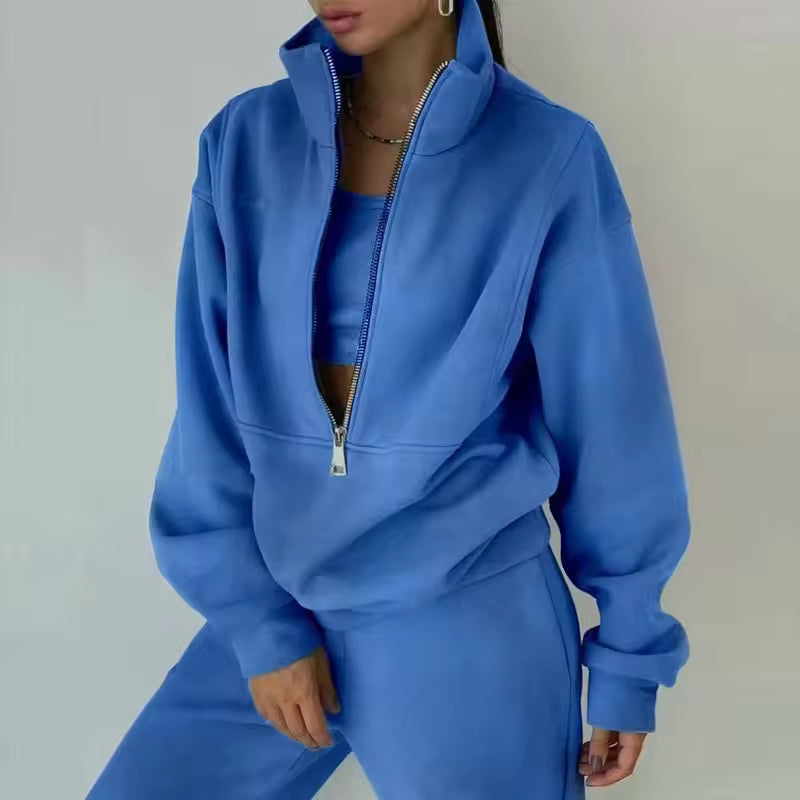 Brielle Blue two-piece tracksuit with stand collar, long sleeves, partial zip closure, and matching pants