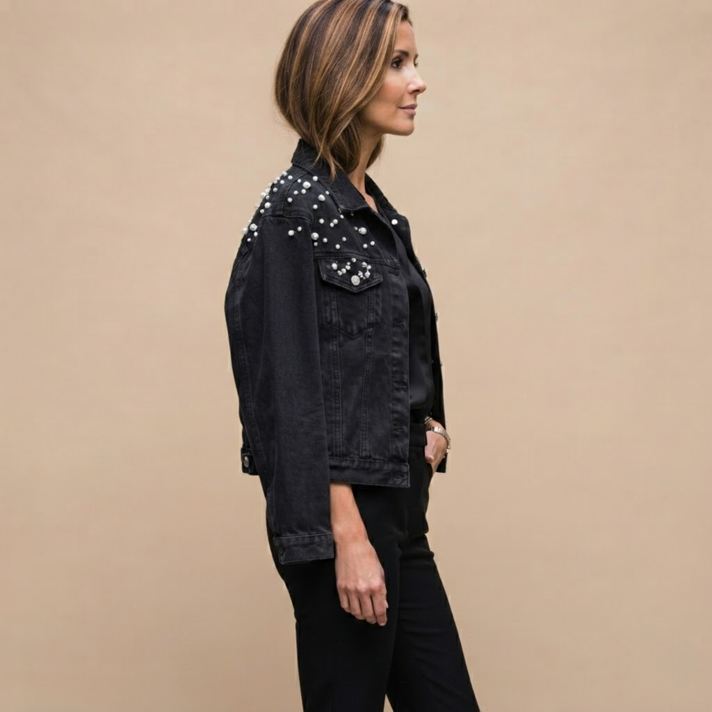Side view of the Brigitta Jacket Denim Studded Button-Front in Black, showcasing its structured denim fit and studded detailing. Designed by Bella Hudson.