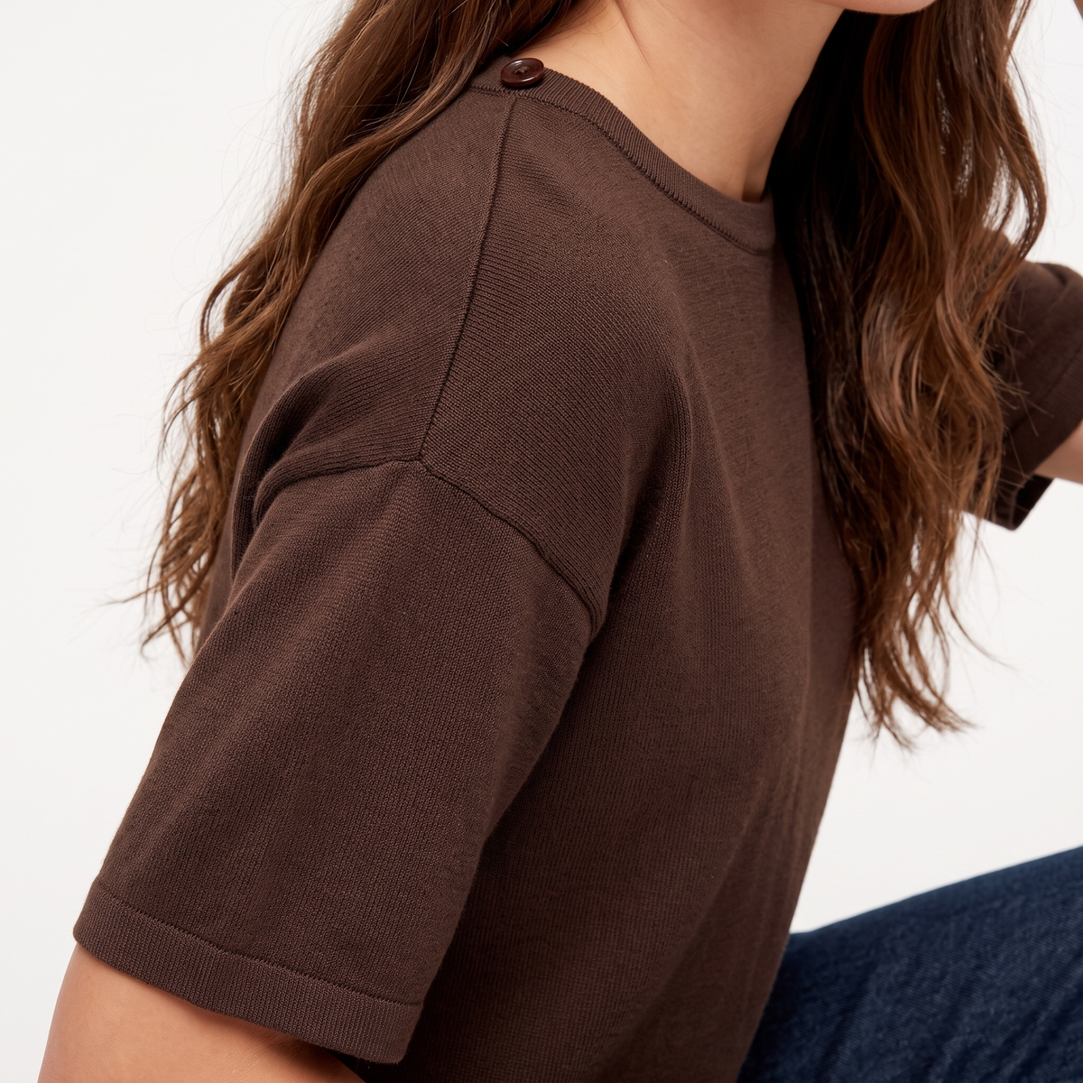 Briony Brown knit T-shirt close-up of the dropped shoulder, ribbed sleeve cuff, and knit texture.