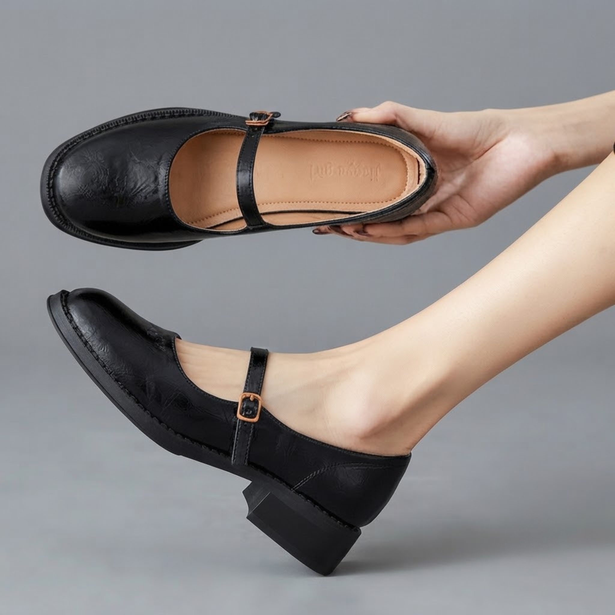 Britt Mary-Jane Flats Block-Heel in Black shown in front view, featuring a classic closed-toe design, adjustable buckle strap, comfortable low block heel, cushioned footbed, and timeless Mary Jane silhouette, designed by Bella Hudson.
