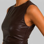 Close-up detail view of brown faux leather sleeveless mini dress with high neckline by BELLA HUDSON