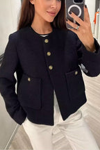 Cadence Black tweed jacket worn open over a black top and white pants, showing gold buttons and patch pockets.