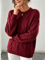 Camila Red cable-knit sweater with vertical braided detailing and relaxed silhouette, styled with pants
