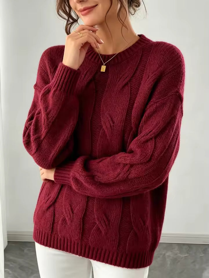 Camila Red cable-knit sweater with vertical braided detailing and relaxed silhouette, styled with pants