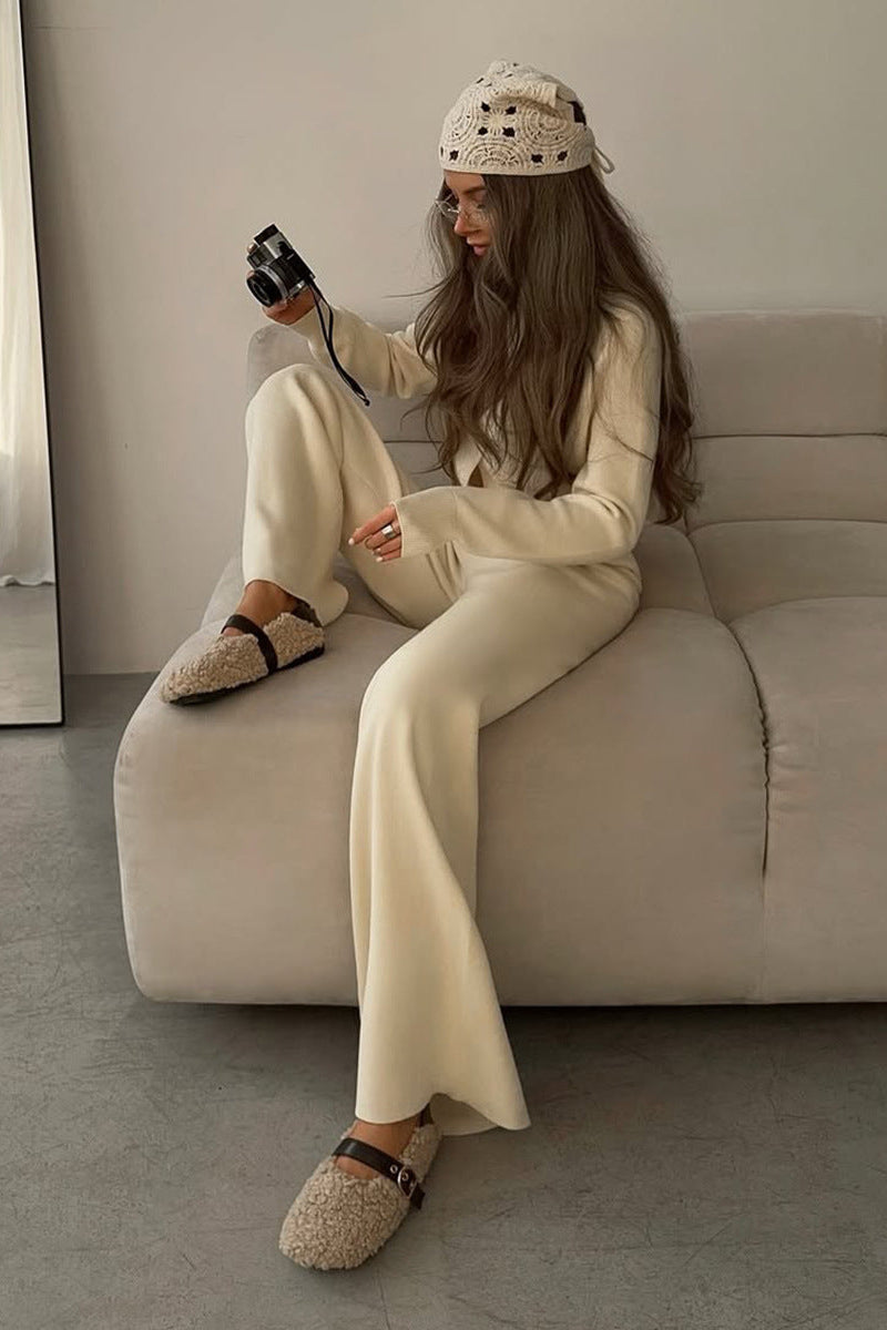 Camille Beige knit cardigan lounge set shown in a relaxed seated pose with a button-front cardigan and coordinated wide-leg pants