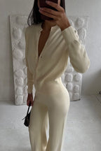 Camille Beige knit cardigan lounge set shown from the side with a fitted button-front top and flowing wide-leg pants