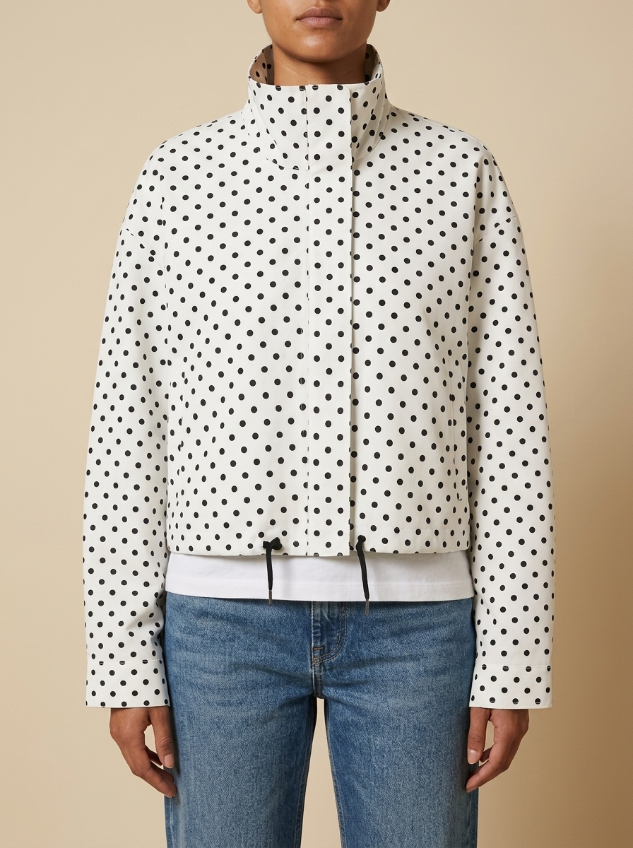 Front view of the white Camille Polka-Dot High-Neck Bomber Jacket for Women featuring polka-dot print, high neck, and zip-through front.