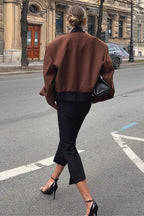 Camille Brown cropped jacket shown from the back with a structured shoulder shape, long sleeves, and relaxed fit