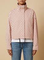 Front view of the pink Camille Polka-Dot High-Neck Bomber Jacket for Women featuring a zip-through front, high neck, and dot print.