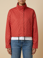 Front view of the red Camille Polka-Dot High-Neck Bomber Jacket for Women featuring a high neck, long sleeves, and dot print.