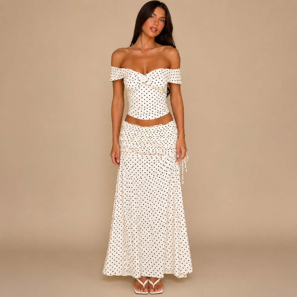 Candice Polka Dot Skirt and Off-the-Shoulder Top Set shown from the front with matching polka dot top and maxi skirt. Designed by Bella Hudson.