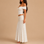 Side view of the Candice Polka Dot Skirt and Off-the-Shoulder Top Set featuring a fitted off-the-shoulder top and flowing maxi skirt. Designed by Bella Hudson.