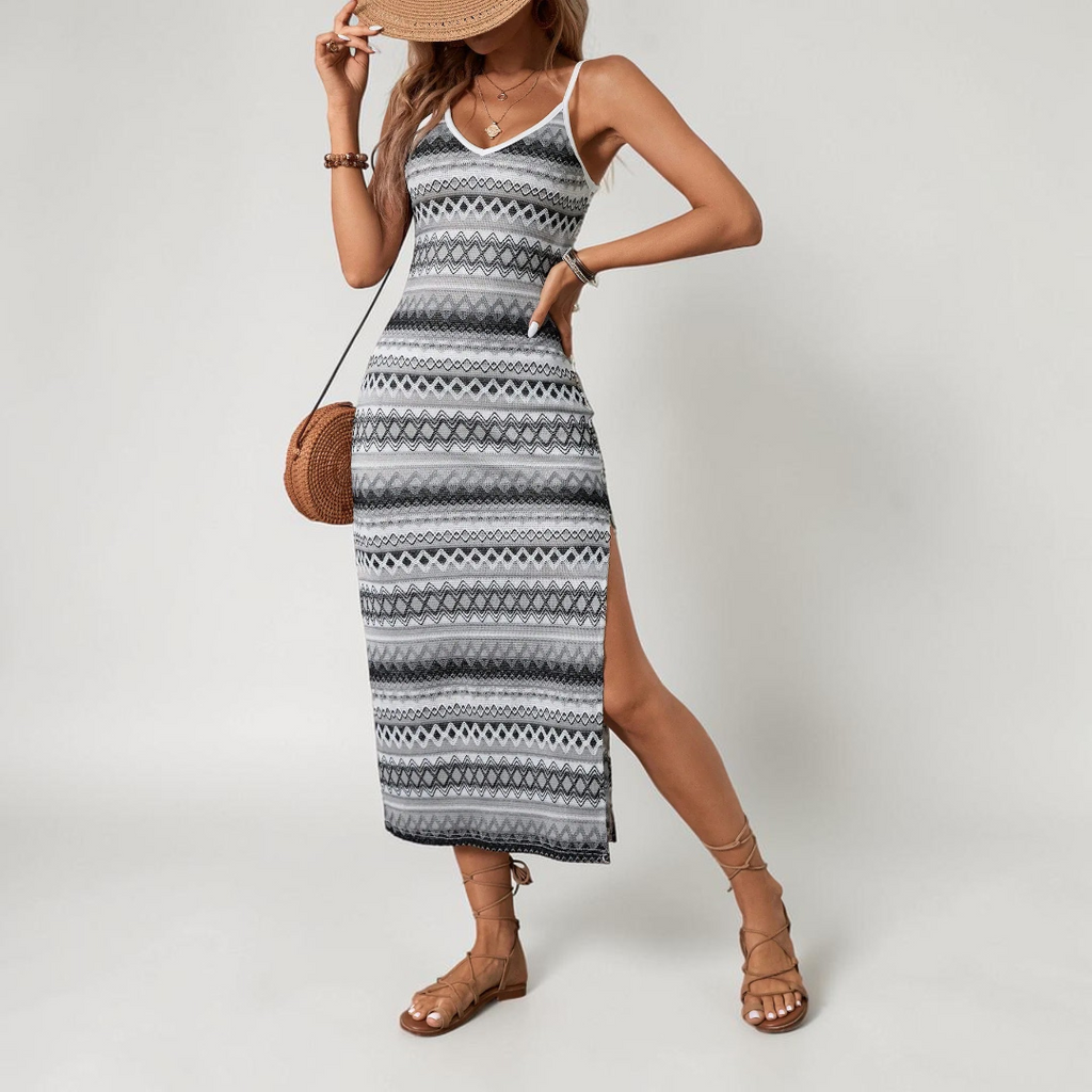 Front view of the Cassia Maxi Dress Knit Striped Cami Side-Slit in black, featuring a sleeveless cami neckline, striped knit fabric, body-skimming silhouette, and elegant side slit. Designed by Bella Hudson.