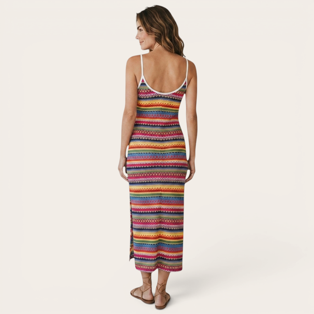 Back view of the Cassia Maxi Dress Knit Striped Cami Side-Slit in pink, highlighting the sleeveless cami design, colorful striped knit pattern, and flattering maxi silhouette. Designed by Bella Hudson.