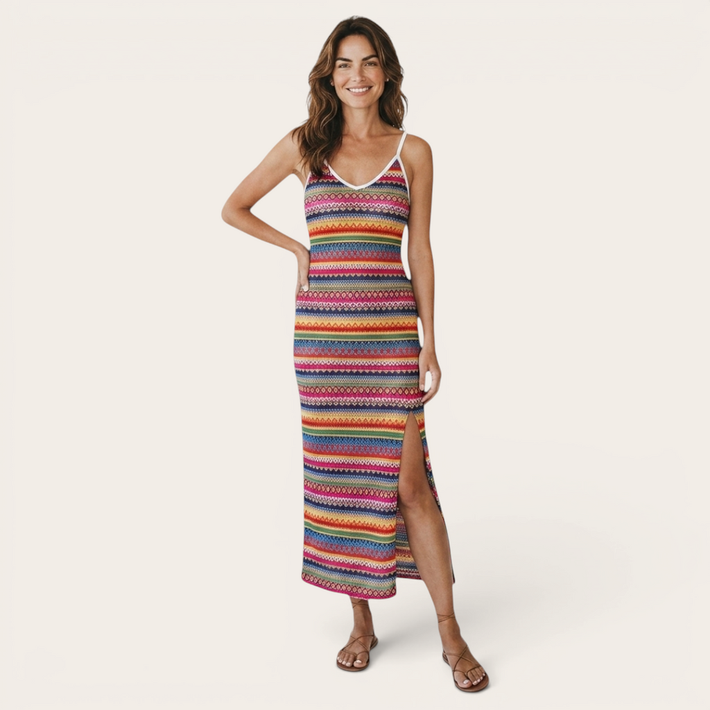 Front view of the Cassia Maxi Dress Knit Striped Cami Side-Slit in pink, featuring a sleeveless cami neckline, colorful knit stripes, body-skimming silhouette, and a side slit. Designed by Bella Hudson.