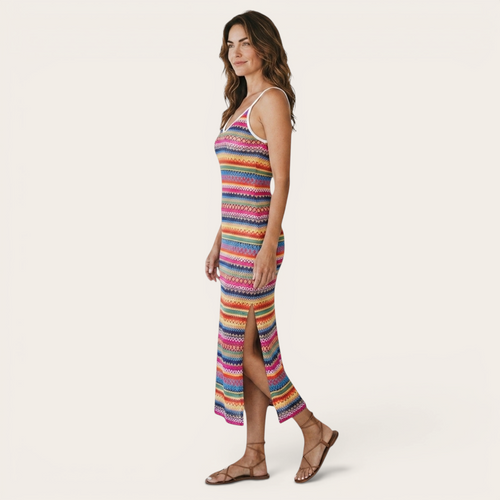 Side view of the Cassia Maxi Dress Knit Striped Cami Side-Slit in pink, showcasing the sleeveless cami straps, striped knit fabric, body-skimming fit, and side slit. Designed by Bella Hudson.