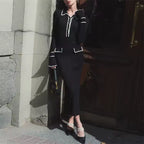 Celine black ribbed knit mini dress with contrast trim, fitted waist, and gently flared hem