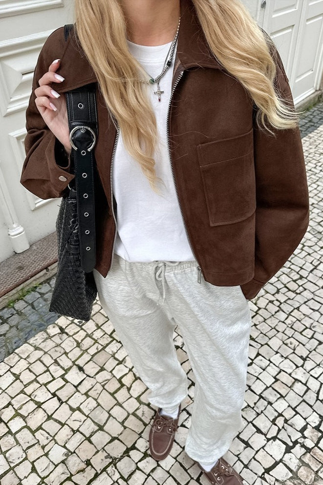 Celine Brown faux suede utility jacket worn over a white tee, showing the chest pocket, zip and snap cuff.