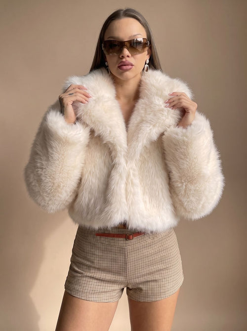 Charlotte Beige cropped faux-fur jacket styled with a relaxed open front, wide lapel collar, oversized sleeves, and short silhouette