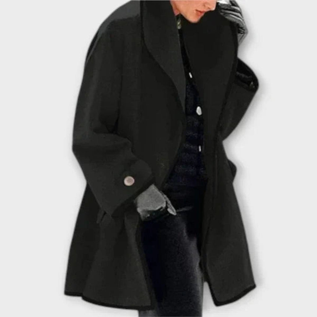 Claire Black oversized swing coat featuring a shawl collar, contrast trim, relaxed long sleeves, and an open-front silhouette