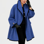 Claire Blue oversized swing coat featuring a wide shawl collar, contrast edge trim, relaxed long sleeves, and an open-front silhouette