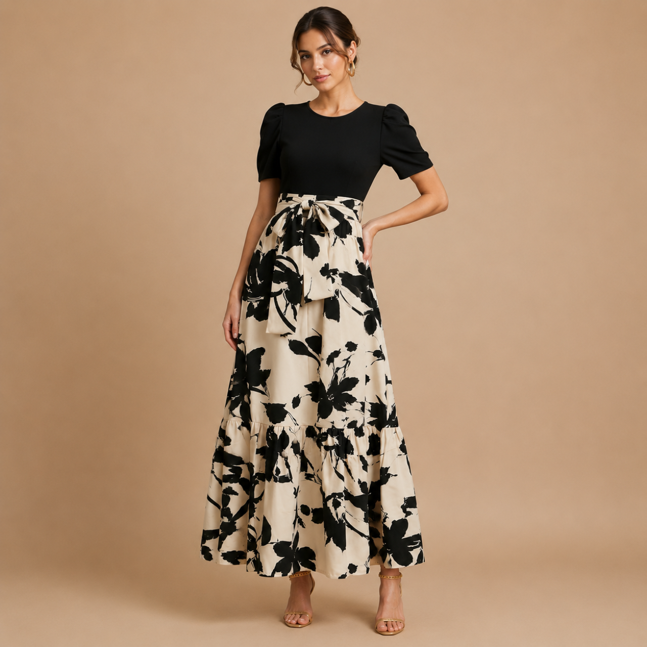 Side view of the Claire Bow-Tie Maxi Dress featuring a bow-tie waist detail and cream floral print skirt. Designed by Bella Hudson.