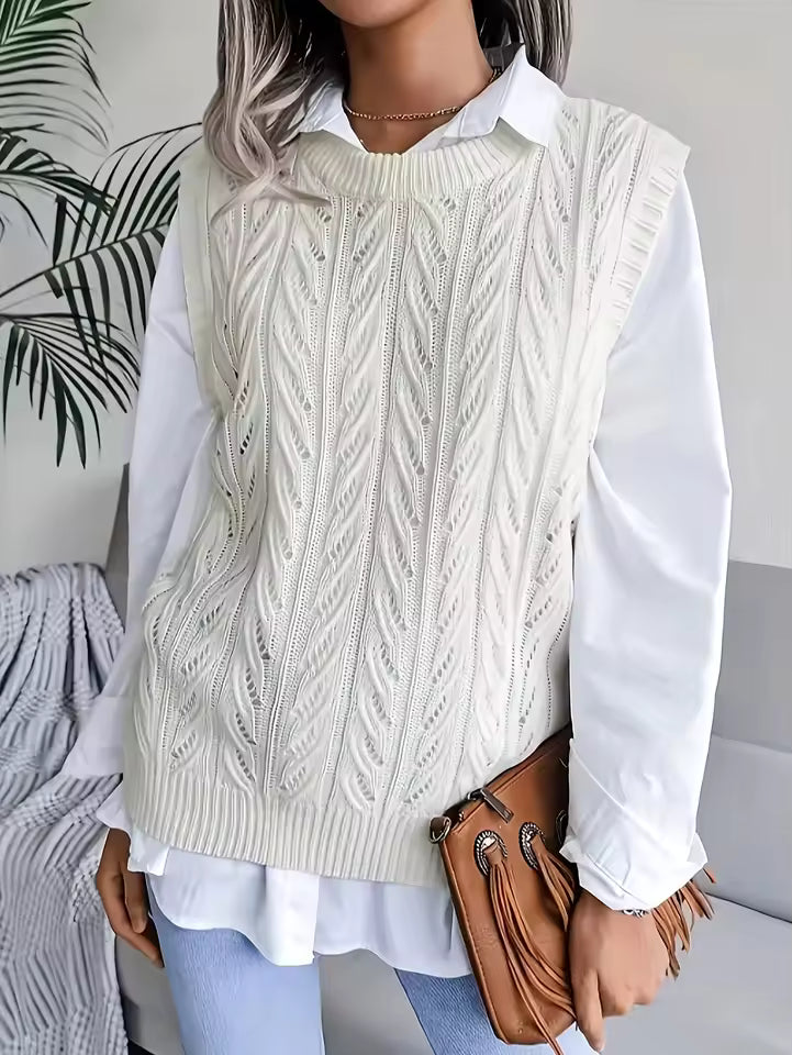 Claire White sleeveless sweater vest featuring textured cable-knit patterns, ribbed trim, and a relaxed fit