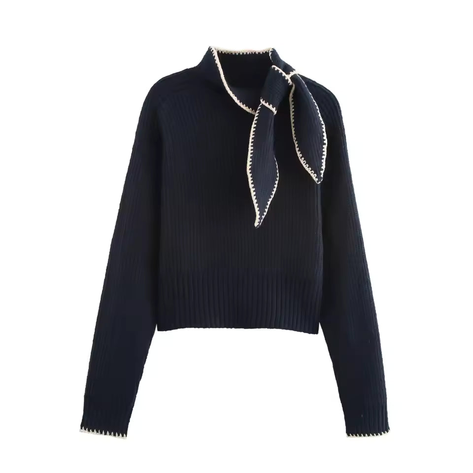 Clara Blue ribbed knit sweater with stand collar, decorative tie-neck detail, long sleeves, and cropped hem