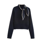 Clara Blue ribbed knit sweater with stand collar, decorative tie-neck detail, long sleeves, and cropped hem