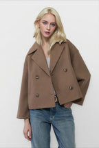 Clara Brown cropped double-breasted coat featuring a structured wide-lapel neckline, relaxed silhouette, and double-row buttons