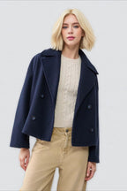 Clara Navy cropped double-breasted coat with wide notched lapels, long sleeves, relaxed boxy shape, and button-front closure