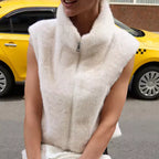 Clara White sleeveless faux-fur vest with stand collar and front zip closure, shown in a close styled view