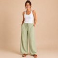 Front view of the Cleo Lightweight Linen Wide-Leg Summer Pants in green, featuring a relaxed wide-leg silhouette and breathable linen fabric. Designed by Bella Hudson.